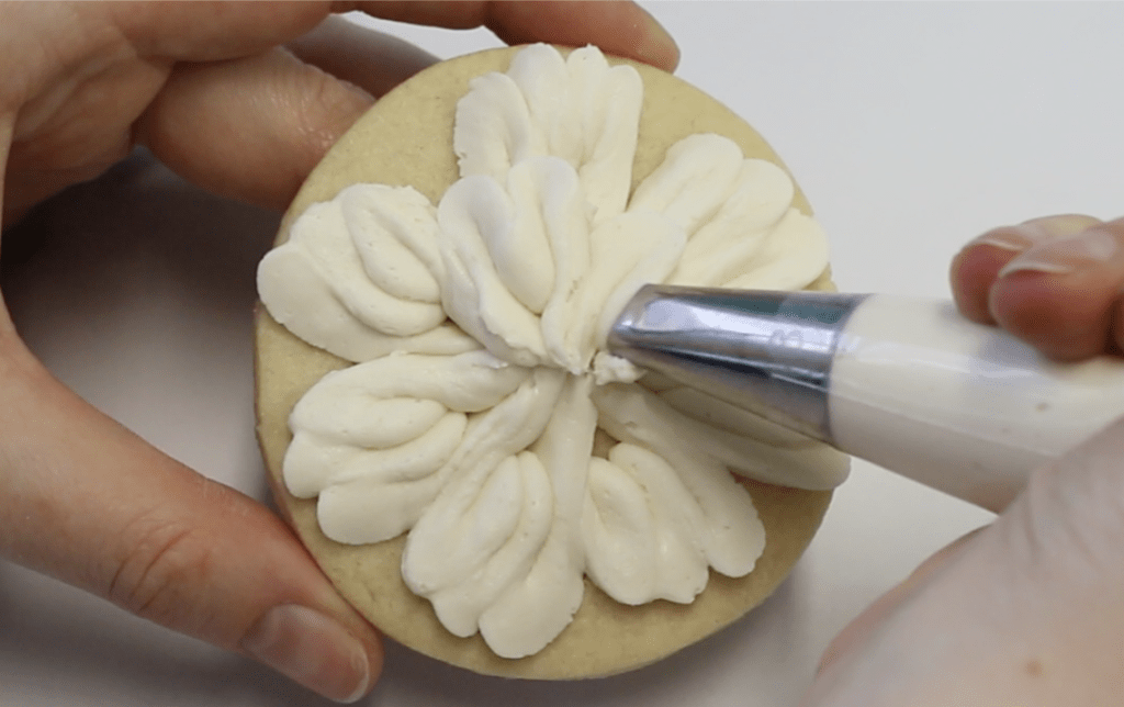 Add a second buttercream petal layer