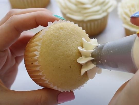 Push the buttercream into the cupcake so it sticks