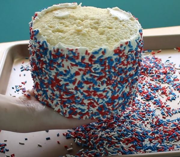 roll cake in sprinkles